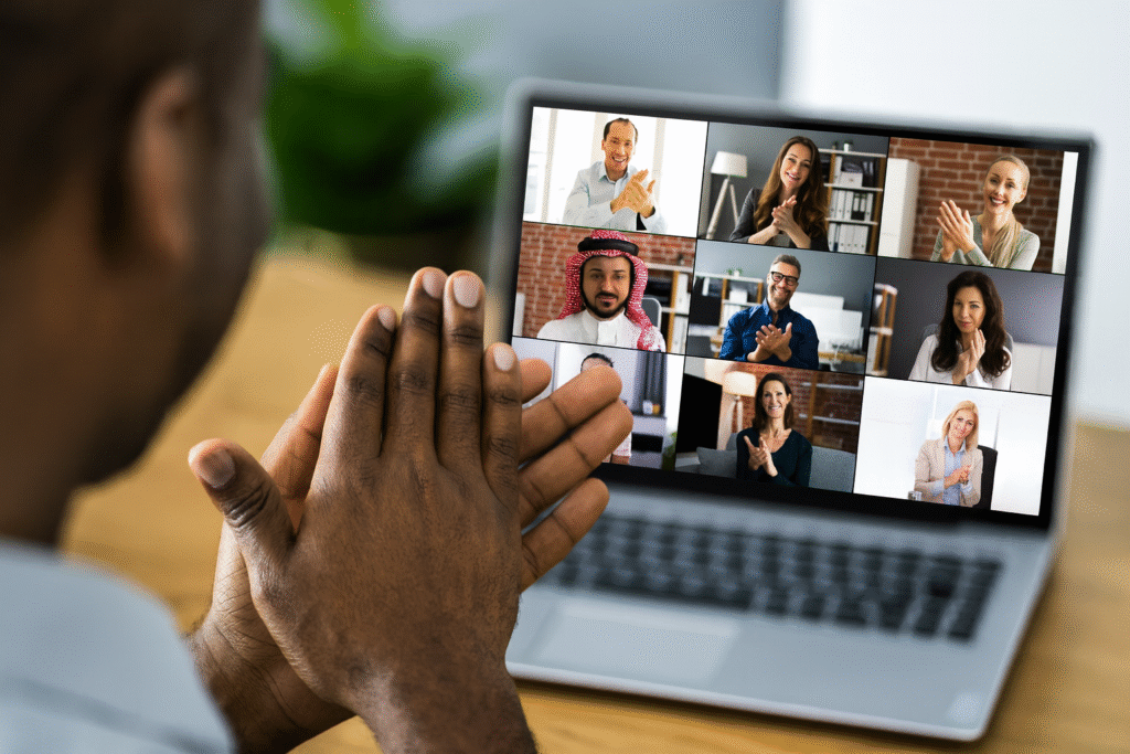 online jobs in saudi arabia - Diverse professionals in Saudi Arabia and abroad collaborating online through a video call, celebrating job success.