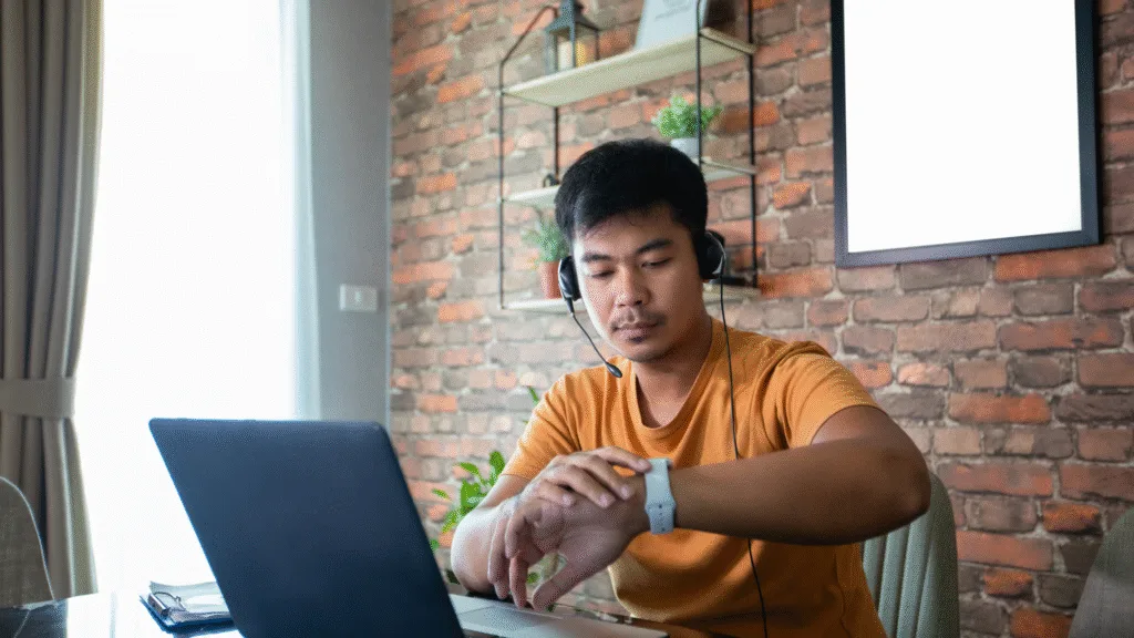 Online Jobs in Saudi Arabia - Young Saudi professional working on a laptop from home in Saudi Arabia, representing remote job opportunities.