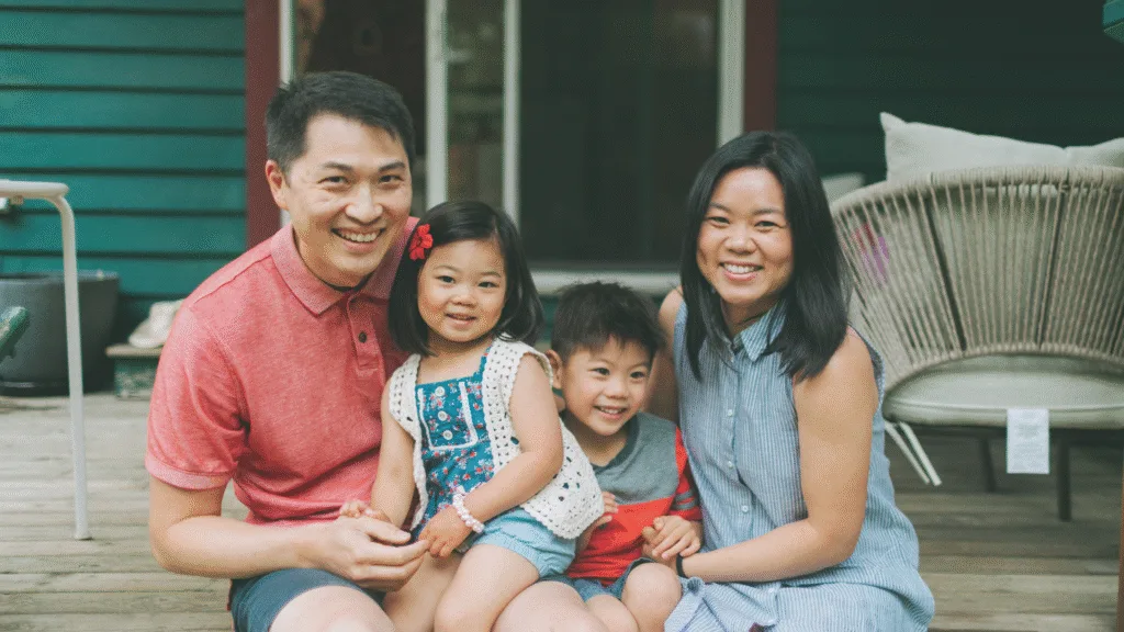 Happy Expatriate family discussing Iqama Renewal Fees process in Saudi Arabia