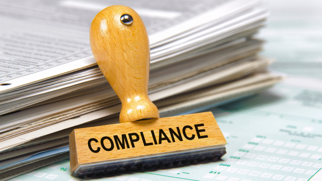 Wooden compliance stamp on documents representing Saudi job application requirements for expatriates.
