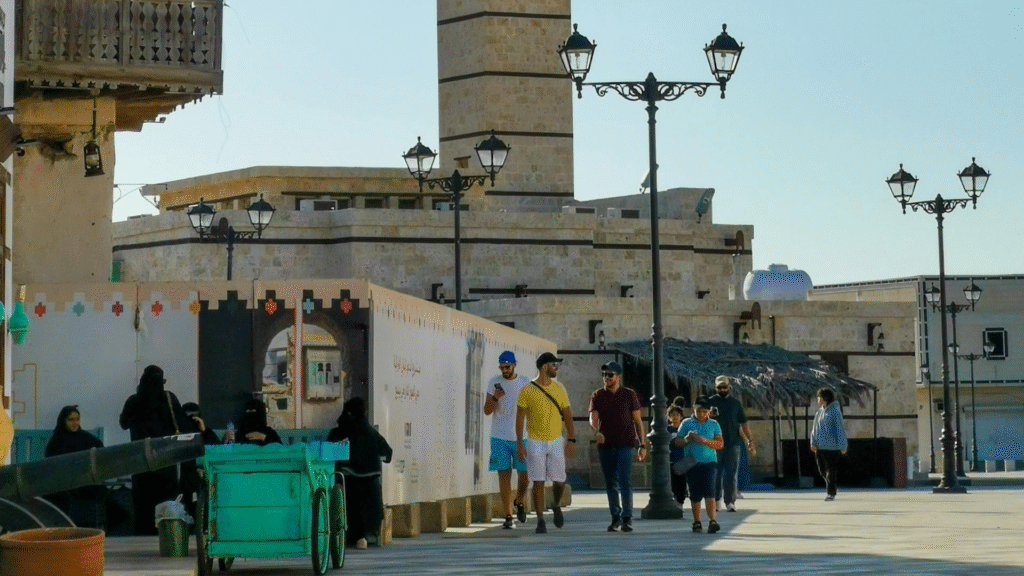 People walking in Yanbu Al Bahr historic district with traditional stone architecture and street lamps
Title (meta title) : Yanbu Historic District – Blend of Tradition and Modern Life