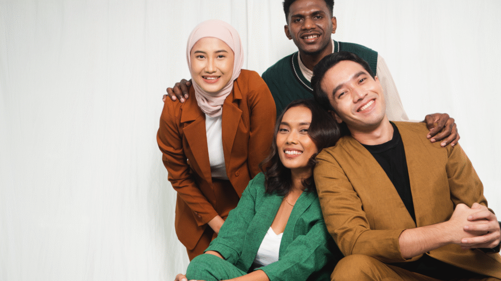 Diverse group of happy young professionals from different backgrounds, representing the multicultural expatriate community and networking opportunities for expatriates in Jeddah.